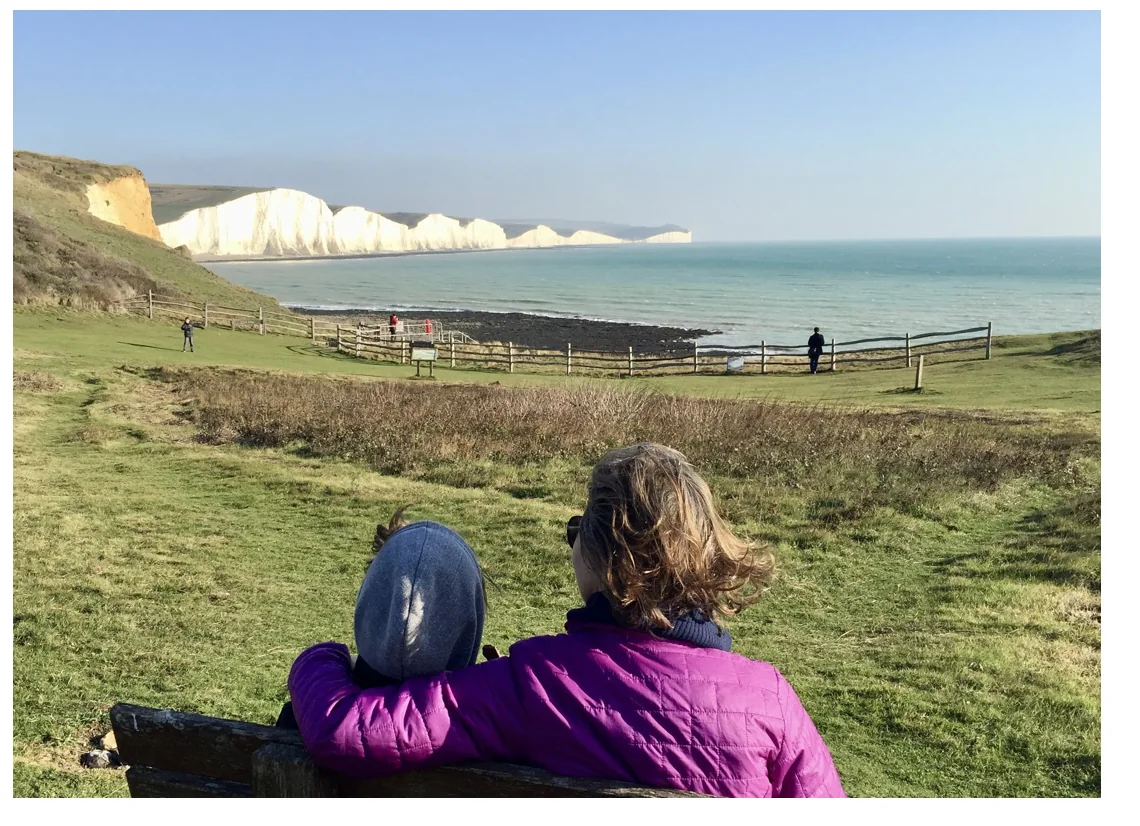 Corinna and her son Ben looking out over the Seven Sisters in East Sussex